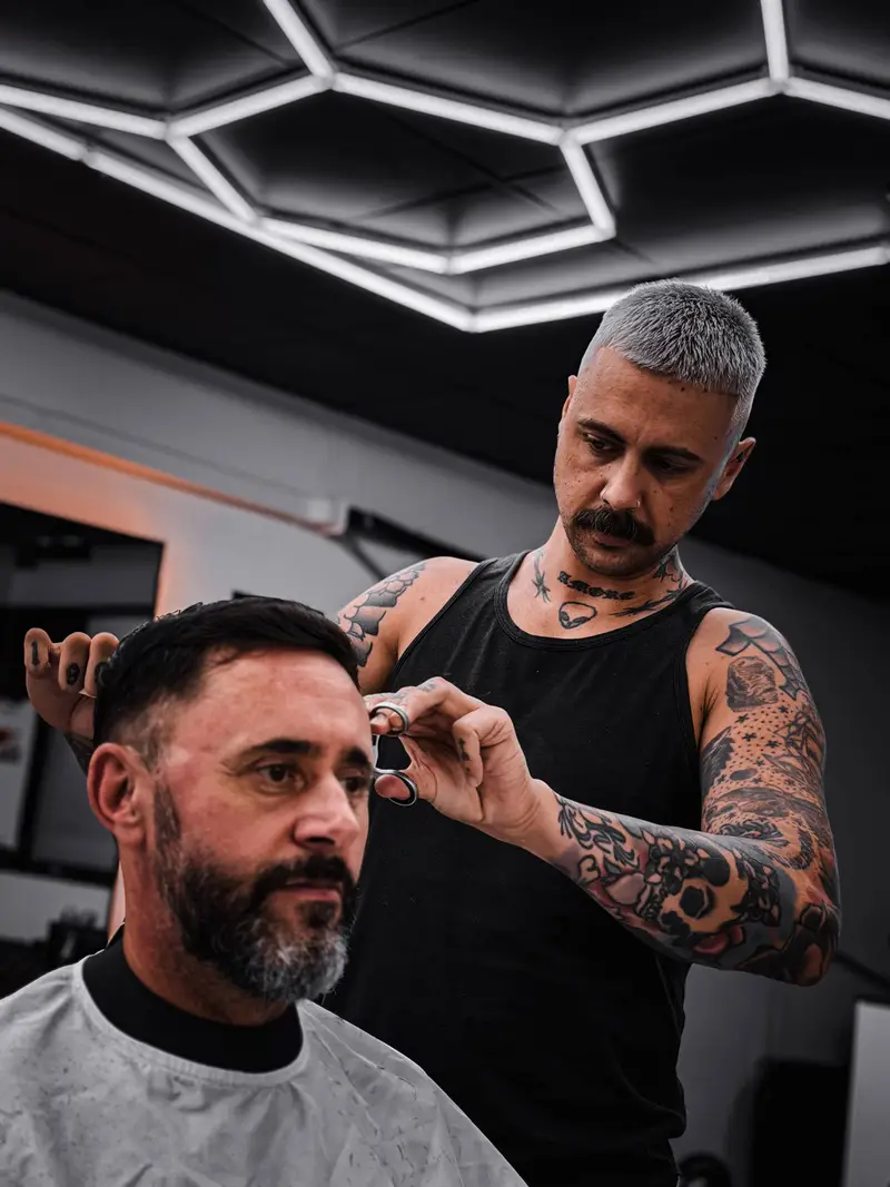 Jack cutting hair at Barber Collective Buderim