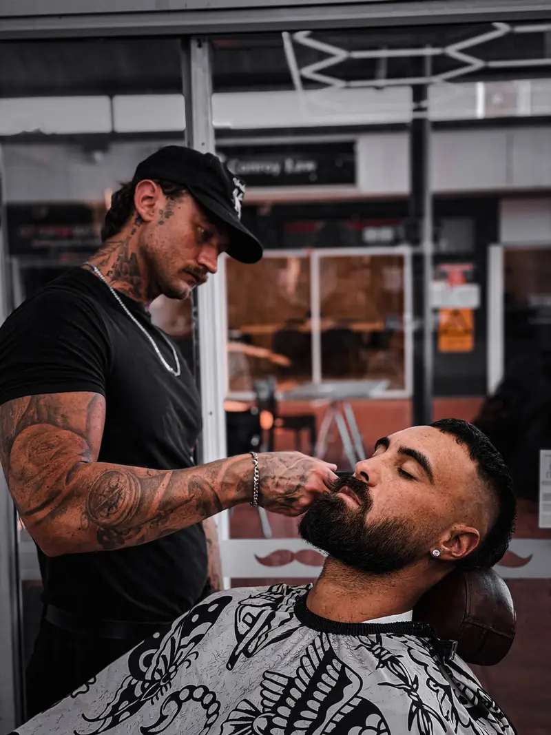 Jacob cutting hair at Barber Collective Buderim