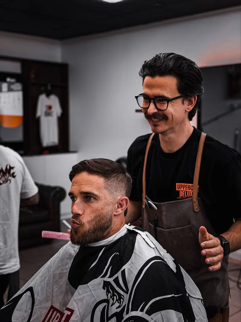 Justin cutting hair at Barber Collective Buderim