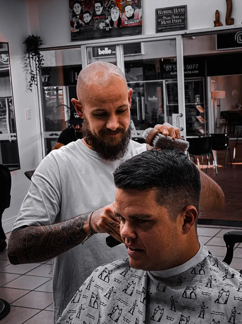 Kieran cutting hair at Barber Collective Buderim